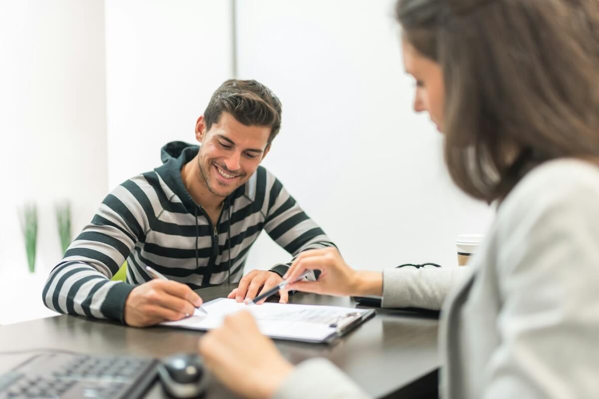 Employee signing a contact with pay transparency